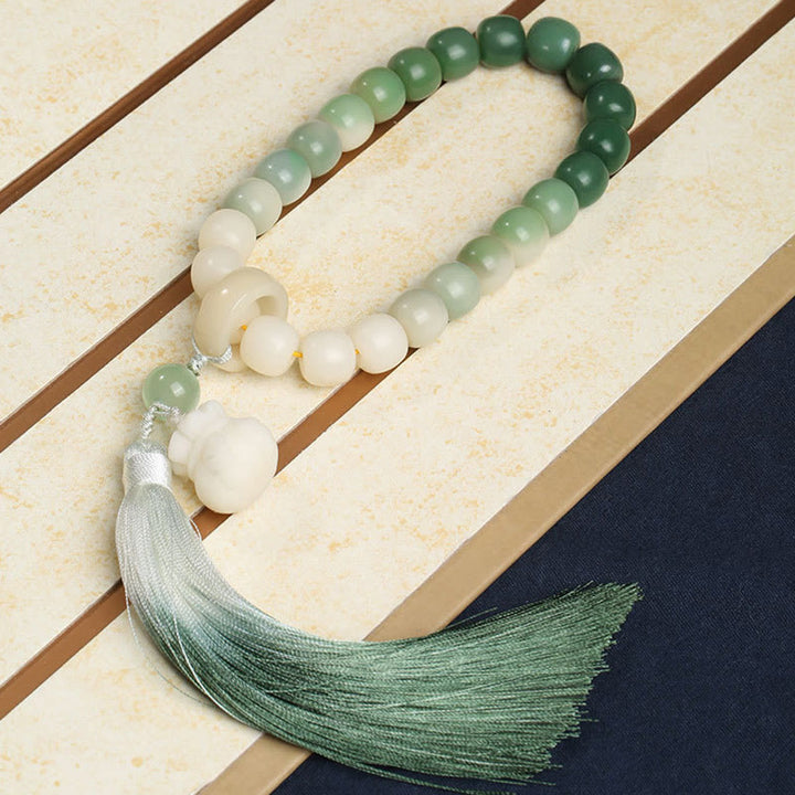 Buddha Stones Naturale Gradiente Bodhi Seed Fortuna Sacchetto di Denaro Loto Saggezza Nappa Polso Mala