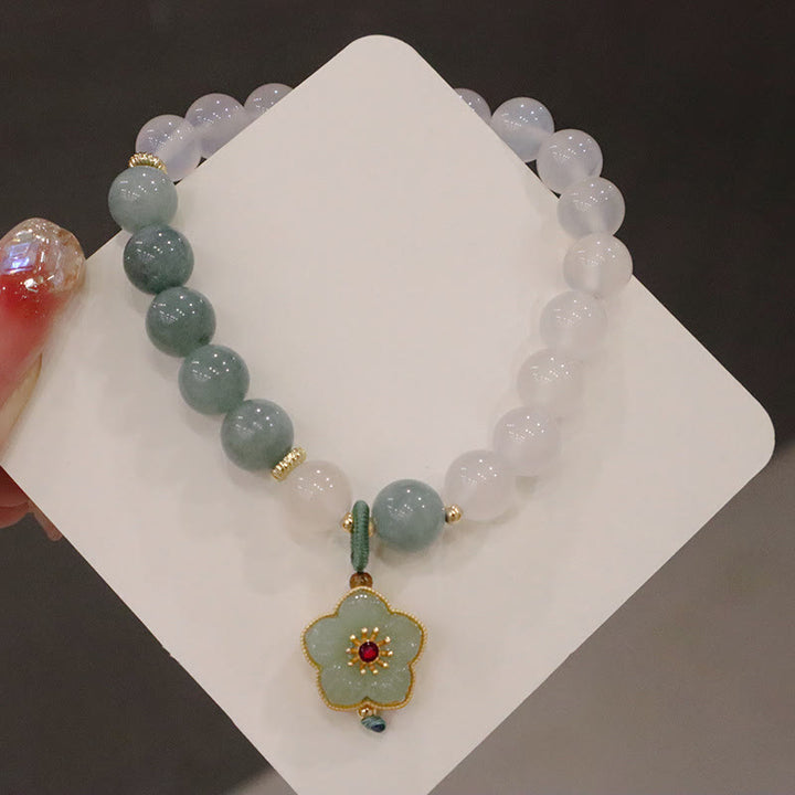 Braccialetto di protezione con fibbia della pace, fiore di loto, agata bianca e giada Buddha Stones