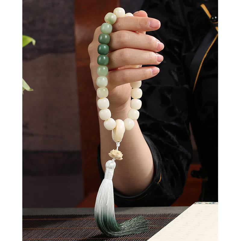 Buddha Stones Naturale Gradiente Bodhi Seed Fortuna Sacchetto di Denaro Loto Saggezza Nappa Polso Mala