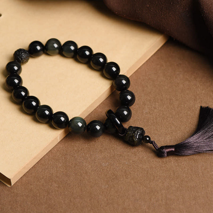 Buddha Stones Ossidiana nera naturale Leone Mala da polso Protezione Nappe Mala tascabile Decorazione per auto