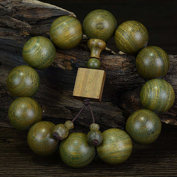 Braccialetto di cura in legno di sandalo verde tibetano Buddha Stones - 20 mm (12 perline) - image 0