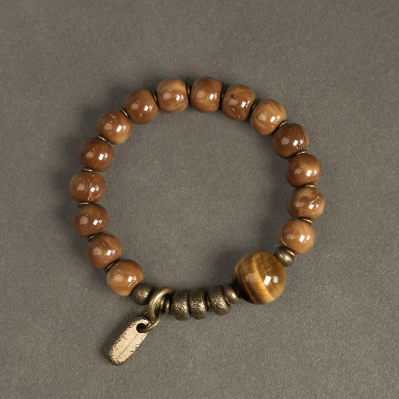 Braccialetto per la fortuna, in ottone, rame e ossidiana , Buddha Stones , semi di Kuka, occhio di tigre e oro lucido - image 1