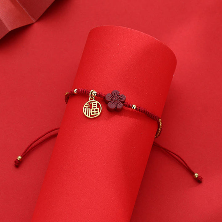 Braccialetto intrecciato con corda e carattere Fu, fiore di cinabro e Buddha Stones