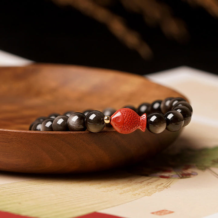 Braccialetto di protezione lenitiva con pesce koi, ossidiana, cinabro, argento naturale e Buddha Stones