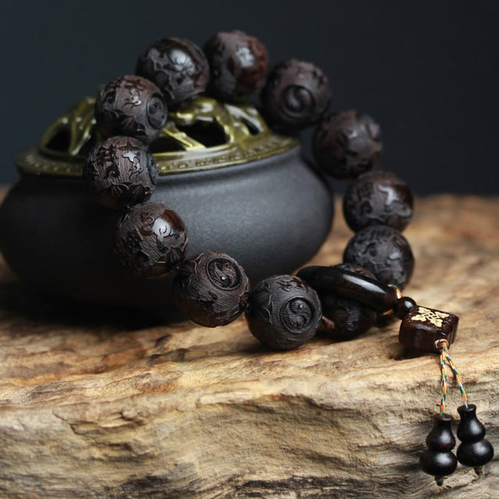 Braccialetto di equilibrio con zucca inciso con carattere cinese Yin Yang in legno di ebano Buddha Stones