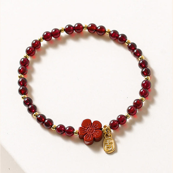 Bracciale Buddha Stones in oro 14K con granato naturale e fiore di cinabro e calma - image 2