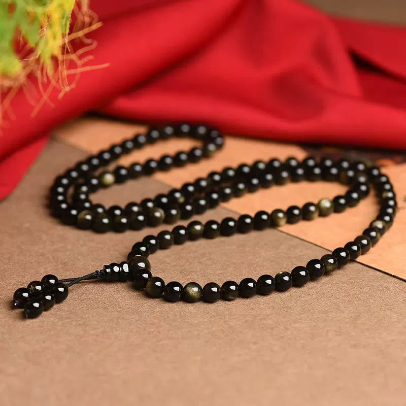 Braccialetto della ricchezza in ossidiana naturale con 108 perle di Mala Buddha Stones