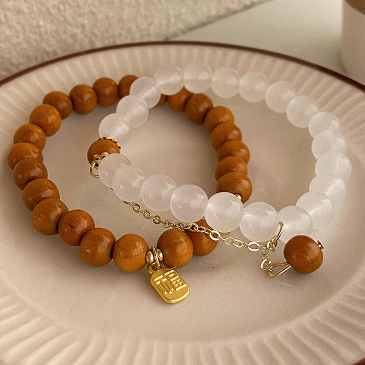 Braccialetto di protezione con ciondolo a forma di carattere Fu con occhio di gatto Buddha Stones in legno di sandalo