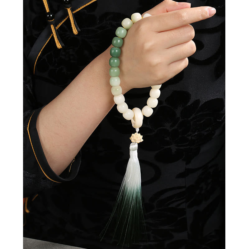 Buddha Stones Naturale Gradiente Bodhi Seed Fortuna Sacchetto di Denaro Loto Saggezza Nappa Polso Mala