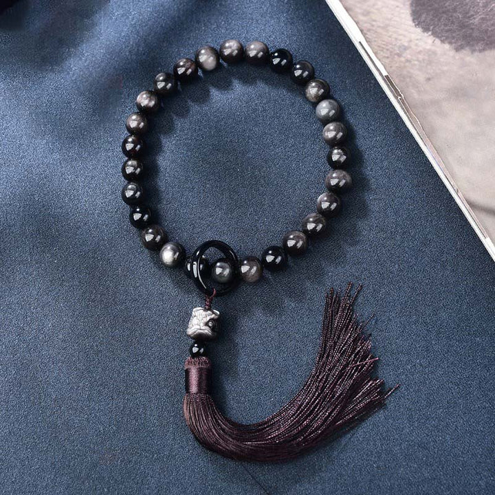Buddha Stones Argento naturale Ossidiana lucente Leone Mala da polso Protezione Nappe Mala tascabile Decorazione per auto