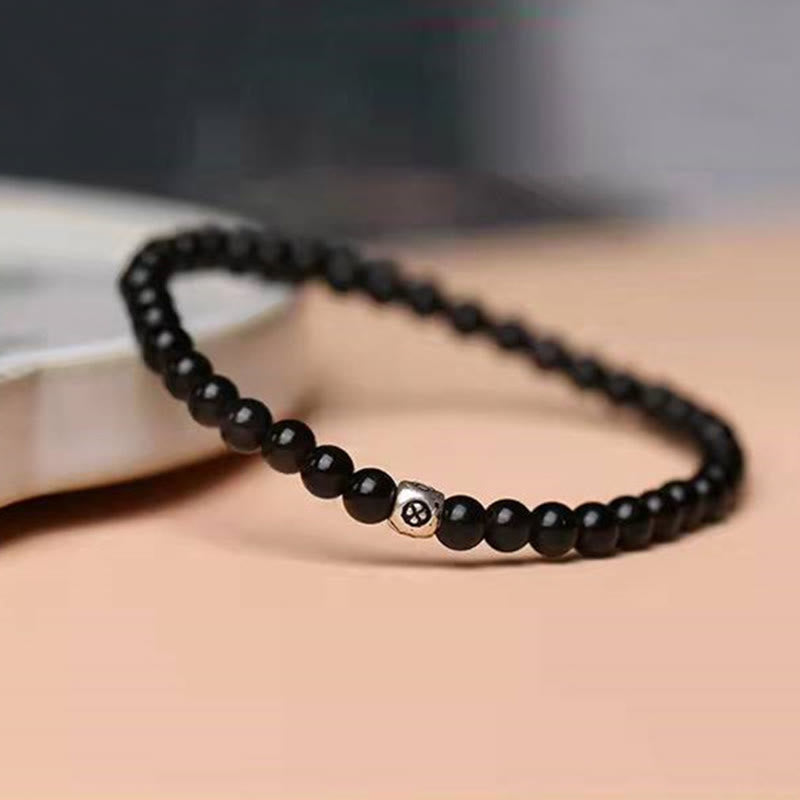 Bracciale Buddha Stones in ossidiana nera naturale e quarzo fumé per la forza di purificazione