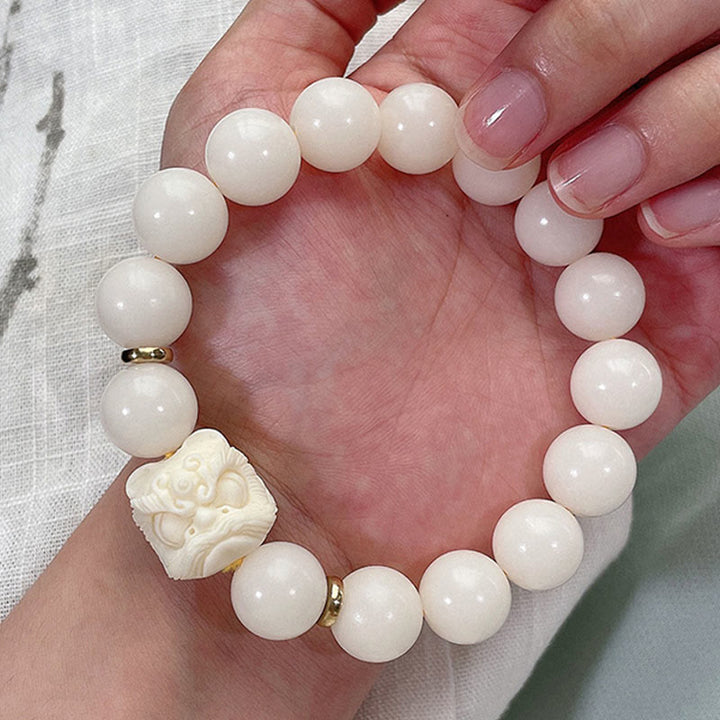 Braccialetto di protezione con leone danzante , Buddha Stones di avorio, seme di Bodhi, pietre di Buddha, argento lucido e ossidiana